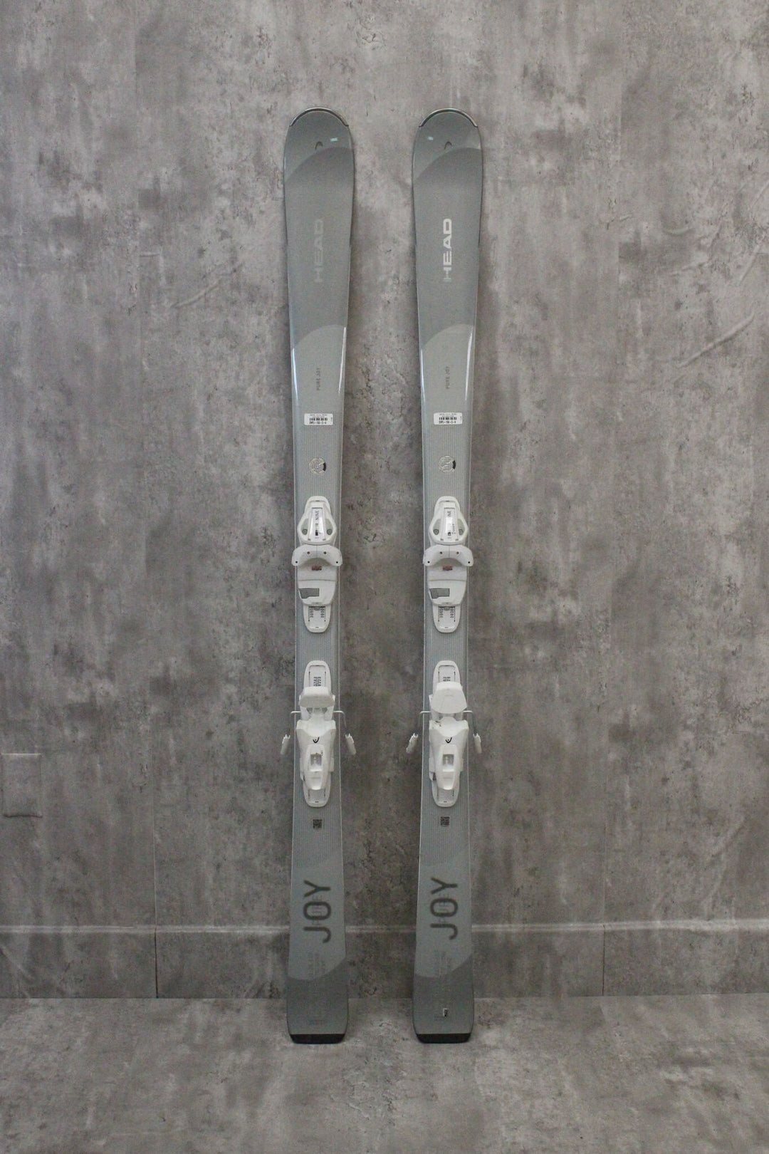 Head Pure Joy skis for women, designed for intermediate to advanced skiers, featuring Better Balance Technology, now available as used skis at Switchback Sports in Park City.