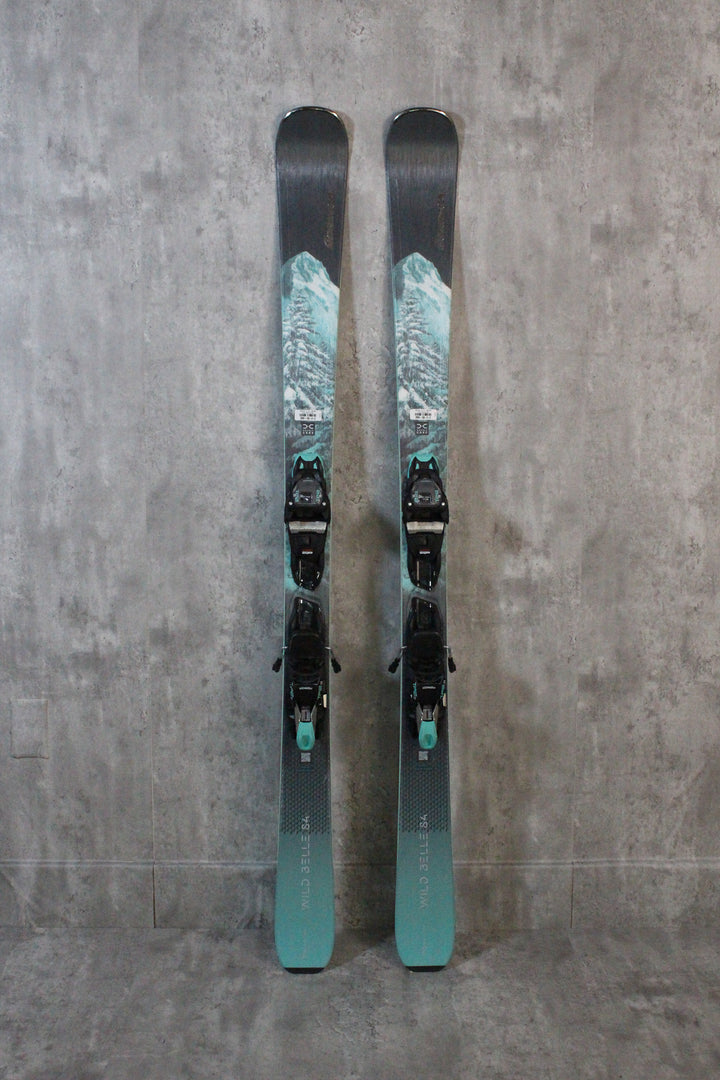 For female skiers seeking excitement, the Nordica Wildbelle 84DC Women's Skis with TP2 11 Bindings 2024 offer top performance with an 84mm waist for groomed runs and powder. The TP2 11 Bindings provide excellent control and precision. Perfect for adventurous skiing on and off the piste. Available as used skis in Park City.